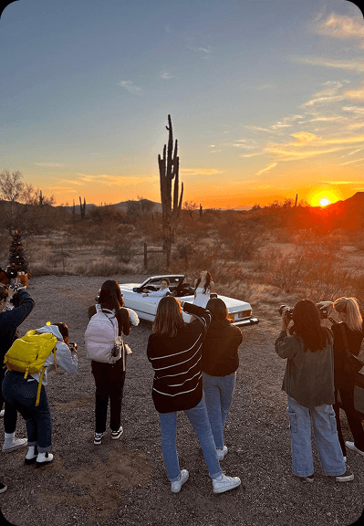 Photographers gathered during sunset for a style shoot