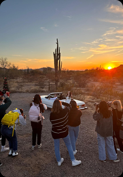 Photographers gathered during sunset for a style shoot